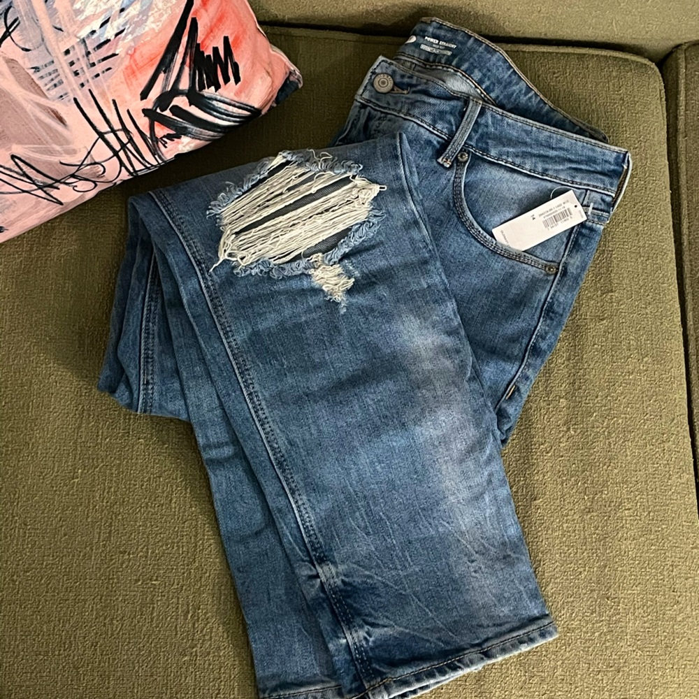 Distressed light skinny jeans